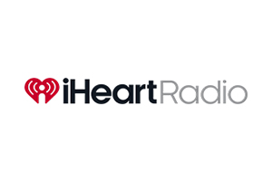 IHeartRadio logo with a red heart containing radio waves on the left and the words "iHeartRadio" in black and gray text on the right.
